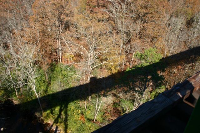 My motorcar casts a long shadow as I pass over Rocky Creek bridge. This is 132 feet down to the water.