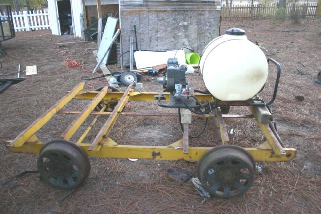 Well, it is taking shape as I mounted the frame to the push trailer frame, next came the tank and tightening up on the hose clamps.